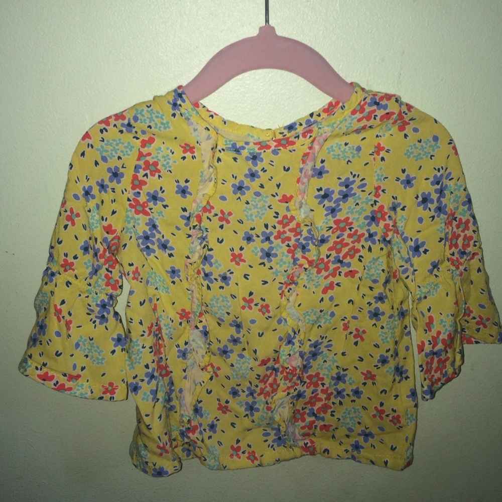 Yellow, floral top.